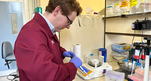 Man looking at equipment in a lab side on