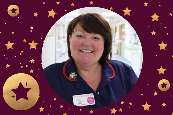 Aly, a Sister in an Outpatients department at the Royal Marsden hospital, smiling at the camera with a maroon frame with gold stars.