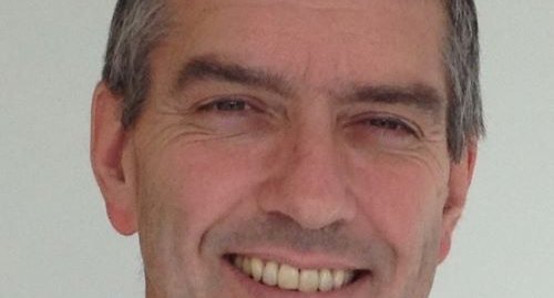 A headshot of Professor Pettitt smiling.