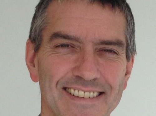 Andy smiles at the camera.