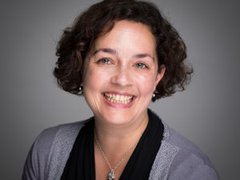 Headshot of Professor Claire Edwards smiling.