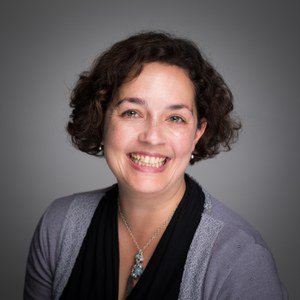 Headshot of Professor Claire Edwards smiling.