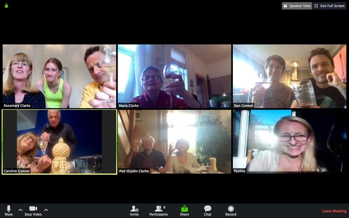 A screenshot of six people on a Zoom call, all smiling.