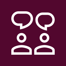 A Blood Cancer UK branded icon in white and maroon of two people with speech bubbles above their head, as if in conversation with one another.