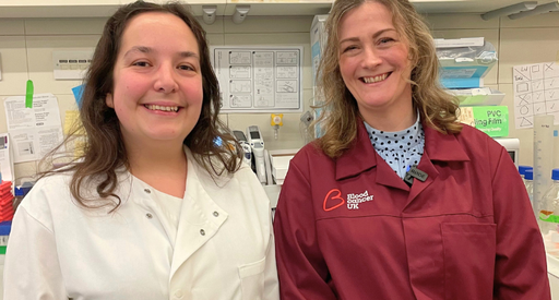 Dr Beth Payne & Dr Alexandra Lubin stood in the lab wearing their lab coats.