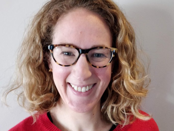 Close up photo of Helen Rowntree, Chief Executive of Blood Cancer UK, smiling.