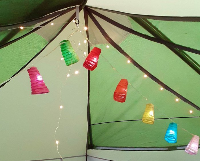 Close up photo of fairy lights in a tent.