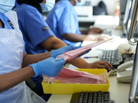 Nurses preparing IV infusion bags