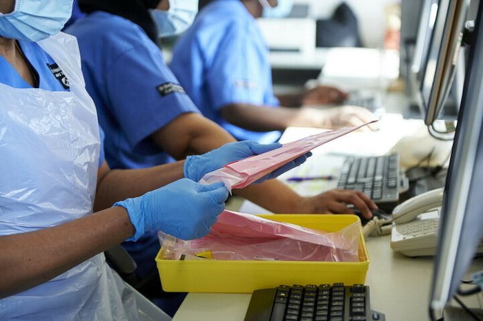 Nurses preparing IV infusion bags