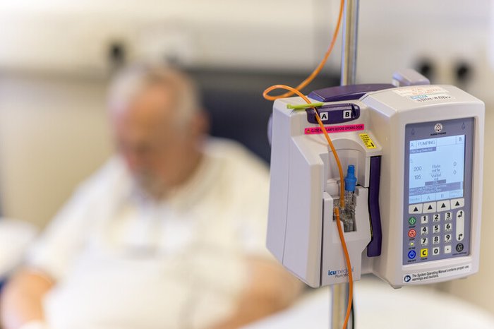 Infusion pump with man in the distance