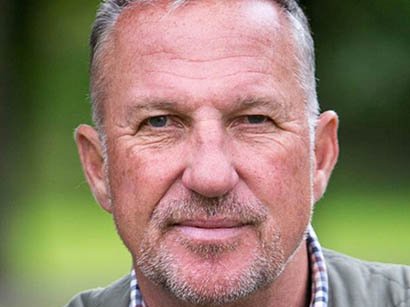 A headshot of Ian Botham, famous cricketer and Founding President of Blood Cancer UK.