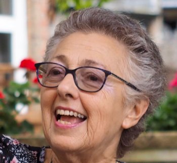 Head shot of Marilyn, living with myelofibrosis since 1990. She is smiling broadly.