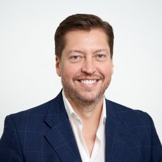 Man smiling in a suit