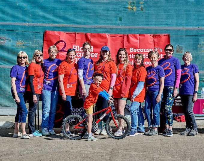 Supporters from the Grimsby Branch of Blood Cancer UK wear their charity T-shirts outside in the sunshine