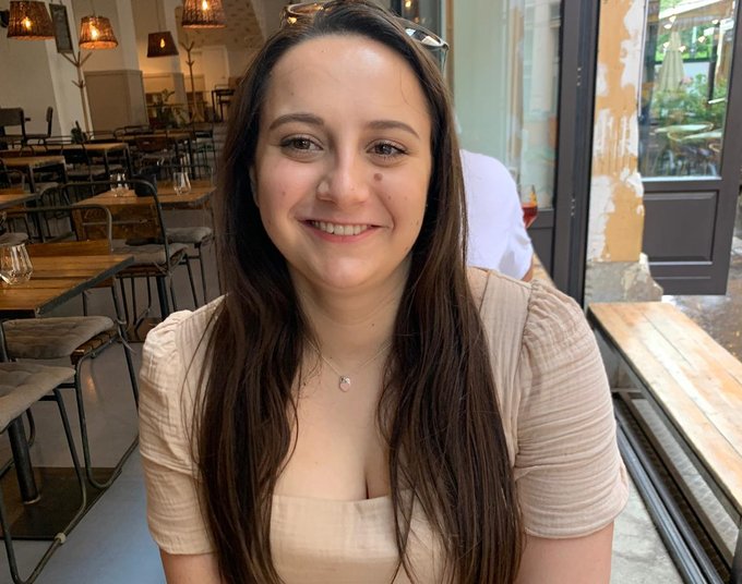 Alana smiling in her favourite restaurant
