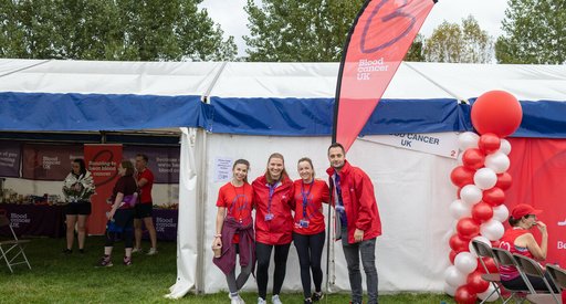 Group of volunteers infront of white tent at the Great North Run