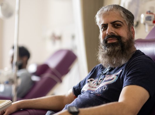 A male in hospital looking at the camera