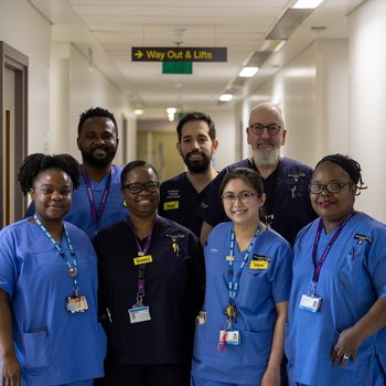 A group of healthcare professionals in uniform at a hospital