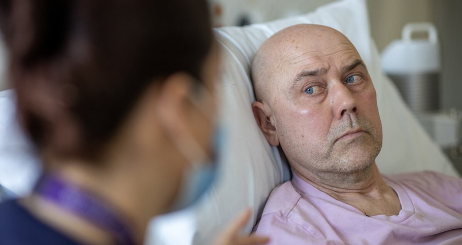 An image of a man in a hospital bed.