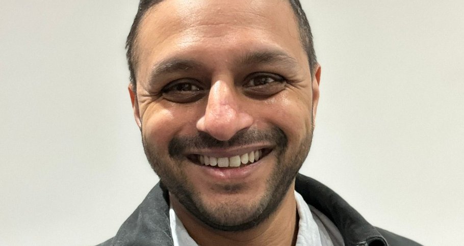 A man in his thirties, Ritesh, smiling.