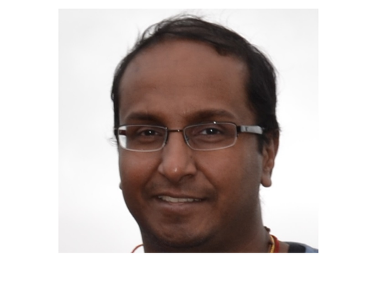 A man, wearing glasses, in a head shot.