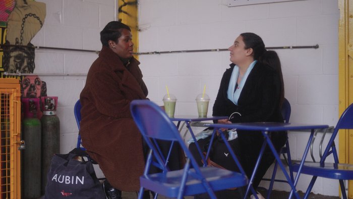 Two women talking in a cafe