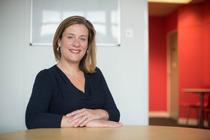 Former Blood Cancer UK Chief Executive Gemma Peters sitting with her arms crossed at a table.