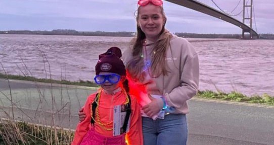 Walk of Light walkers smile at the camera.