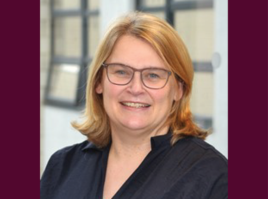 Image of researcher smiling at camera
