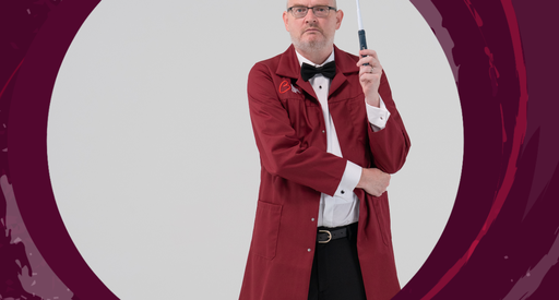 A scientist poses with a medical instrument in a pastiche of the classic James Bond 'eye' image.