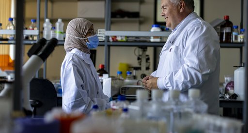 Professor Tonks speaks with another researcher in the lab