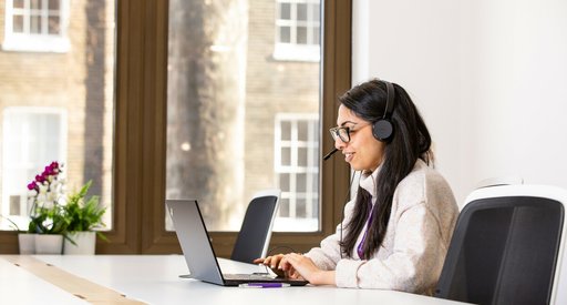Tanya taking a call on the support services helpline.