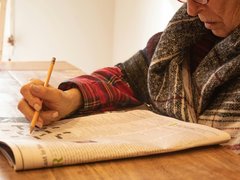 Person doing a crossword