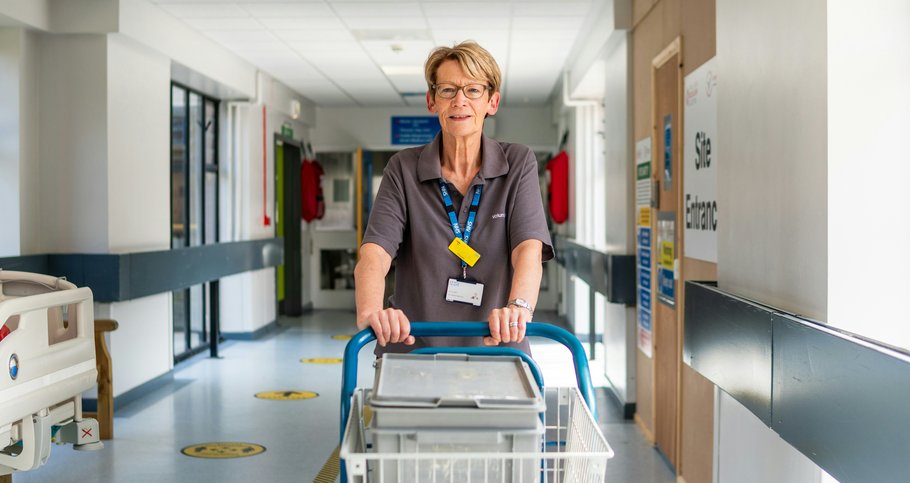 Woman pushing cart in hospital