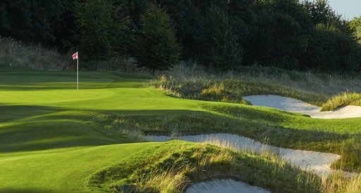The landscape of a golf course on a sunny day.