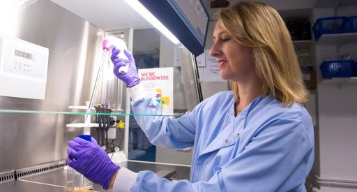 A scientist - Professor Michelle West - working in a lab at the University of Sussex