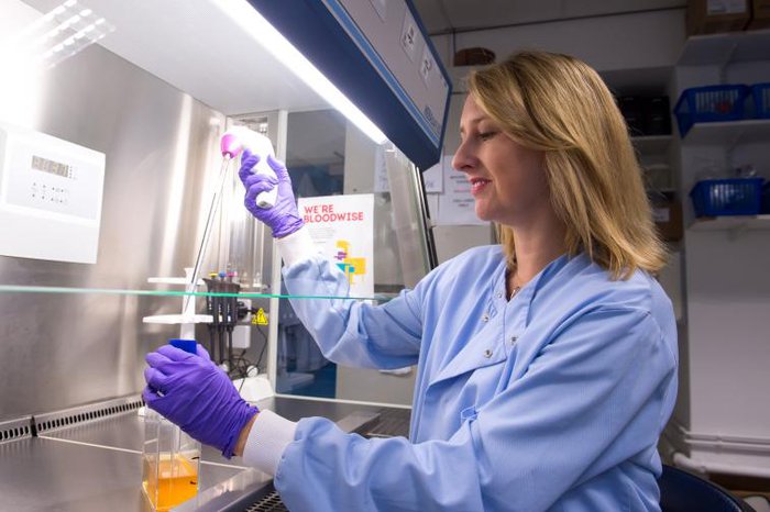 A scientist - Professor Michelle West - working in a lab at the University of Sussex