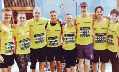Casualty star George Rainsford with the running team. All 8 runners are wearing Bloodwise vests